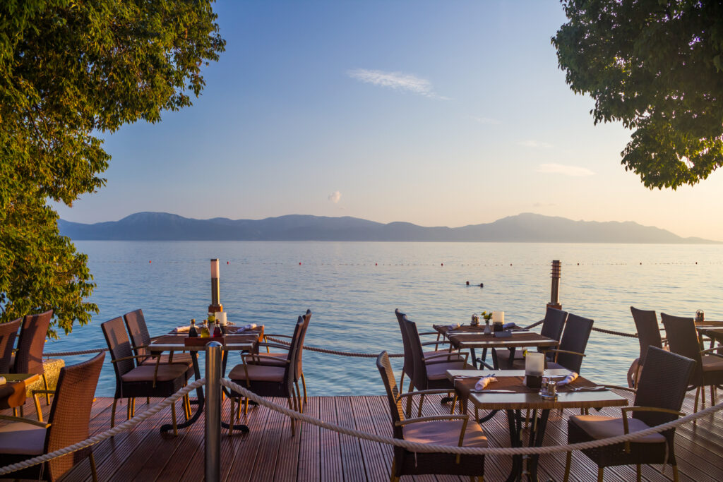 restaurant patio with tables set up overlooking the ocean