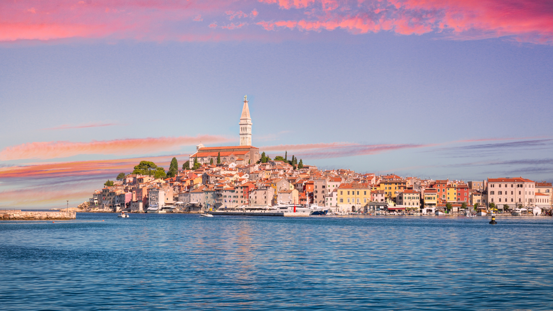 View of the sunset over the town seen from the sea on a luxury Croatia itinerary