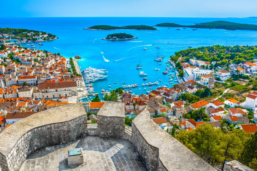 Hvar Town seen from a platform overlooking the Old Town and islands in the distance