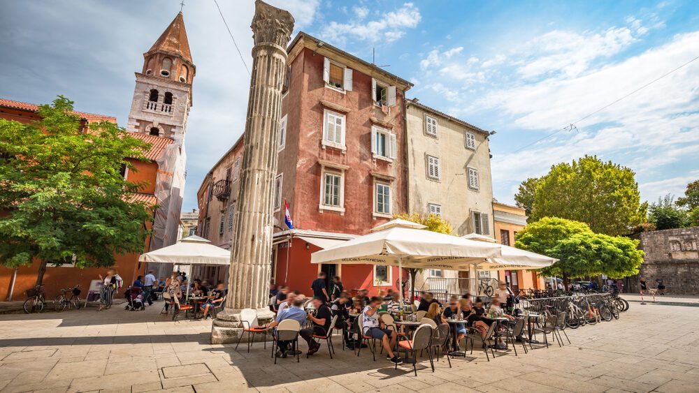 People dining outside in Zadar on a Croatia food tour